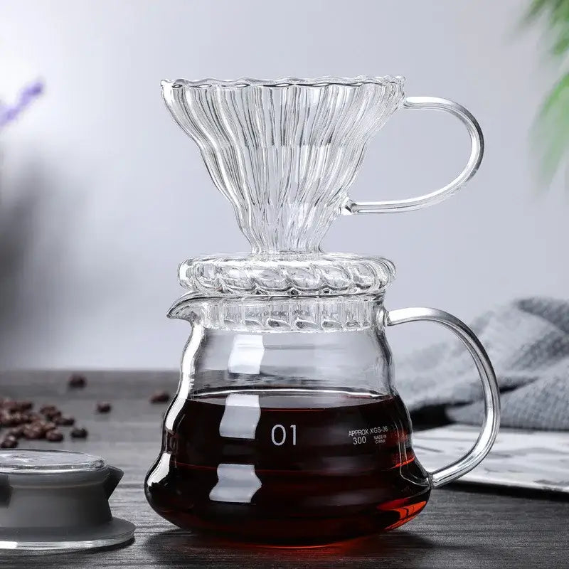 Clear glass ribbed pour over coffee maker pot with fluted cone filter and wood lid for precise coffee brewing