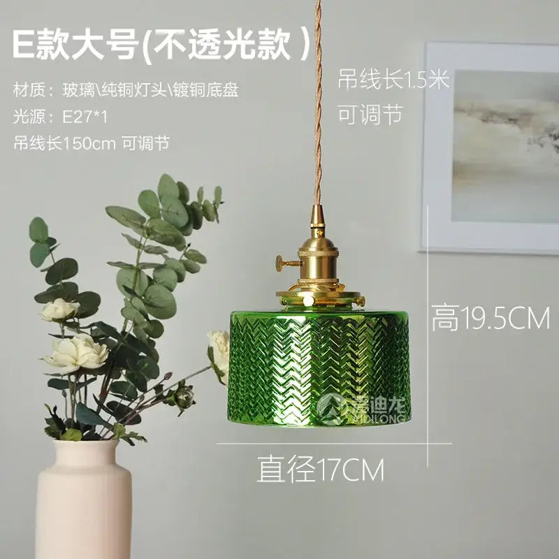 Ribbed green glass pendant light with textured chevron pattern brass hardware and adjustable cord for bedroom use