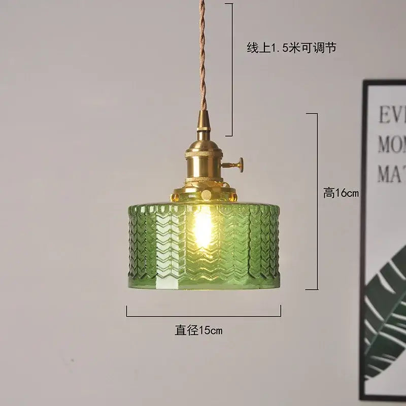 Ribbed green glass pendant light with brass hardware and adjustable cord for bedroom use with textured glass pendant light design