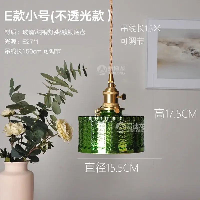 Ribbed green glass pendant light with brass hardware featuring a textured ribbed design for bedroom use