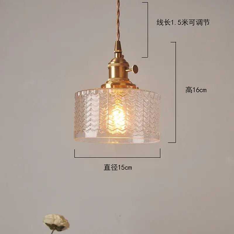 Vintage-style green glass pendant light with brass hardware and textured chevron pattern for bedroom lighting