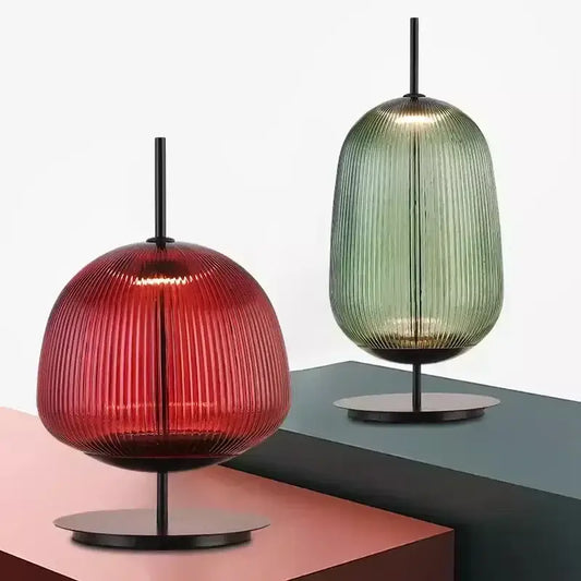 Red and green ribbed glass table lamp with black metal base ideal for bedroom lighting and decorbites green red style