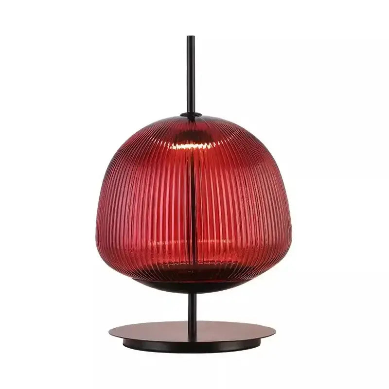 A sleek ribbed red glass table lamp with black metal base for decorbites green red glass bedroom lighting