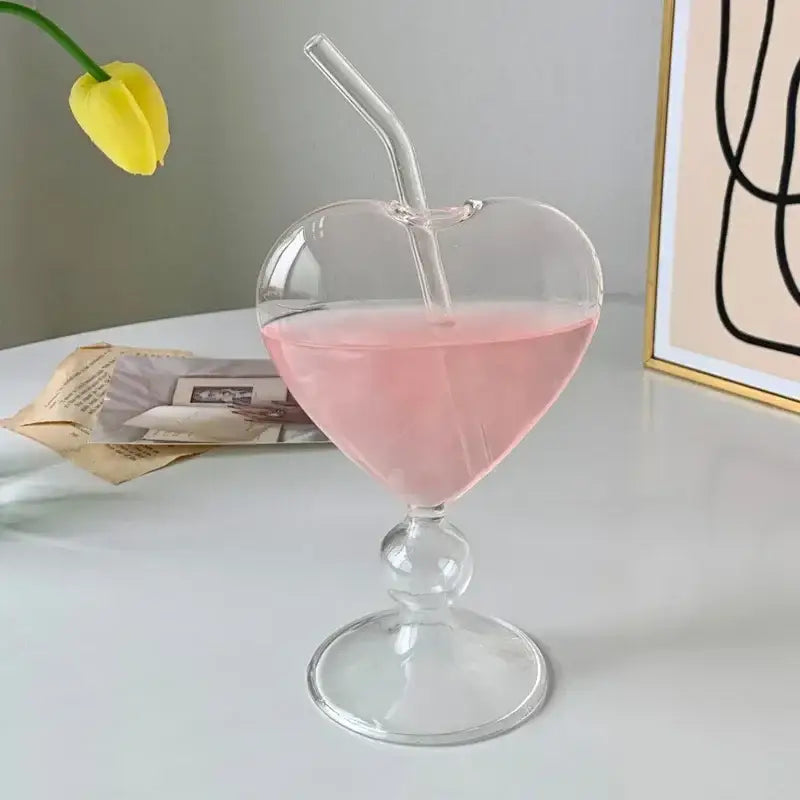 Heart-shaped ribbed glass mug filled with pink liquid and clear straw decorbites heart love glass mugs for couples