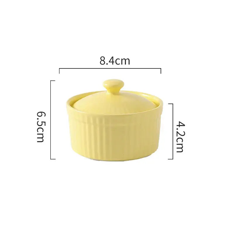Pale yellow decorbites ceramic dessert bowl with vertical ridges and matching lid for elegant dining use