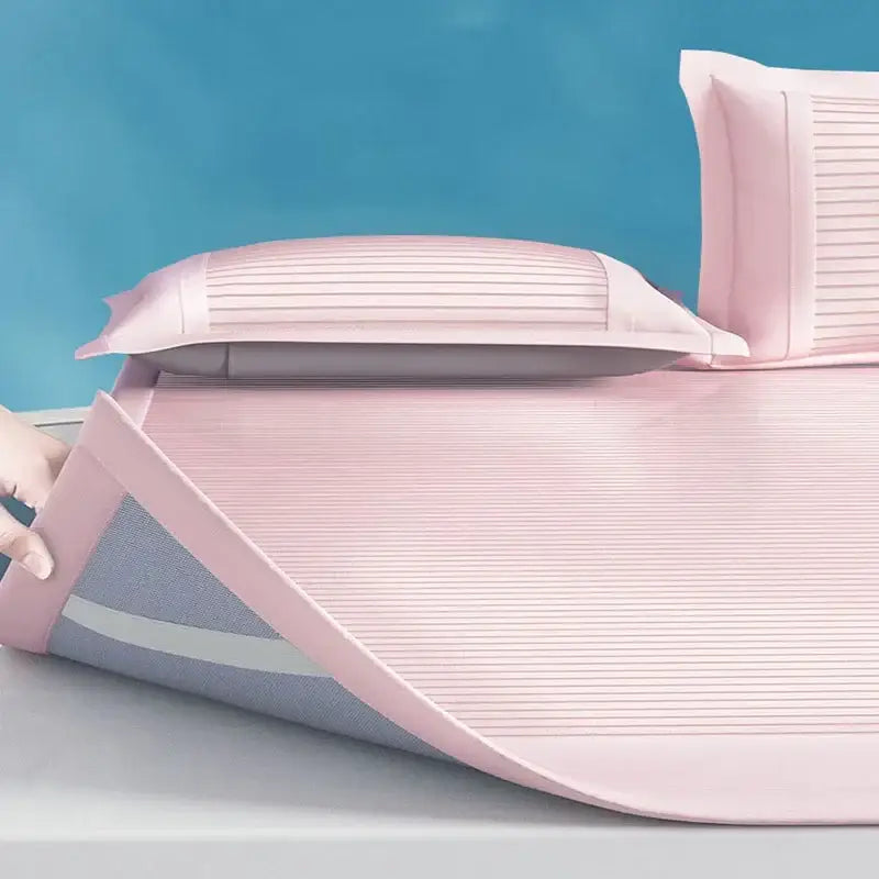 Pink ribbed soft bed mat set with breathable mesh backing and matching pillowcases for comfortable bedroom use