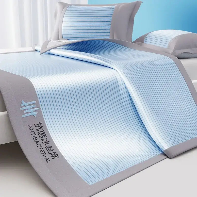 Light blue and gray striped cooling bed mat set with a soft textured surface and ribbed pink pleats for bedroom use