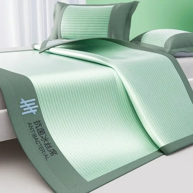 Light green ribbed textured cooling bed mat set with dark green border and antibacterial embroidery for bedroom use