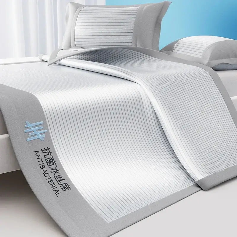 White and gray striped antibacterial cooling bed mat set with ribbed texture for soft bedroom use