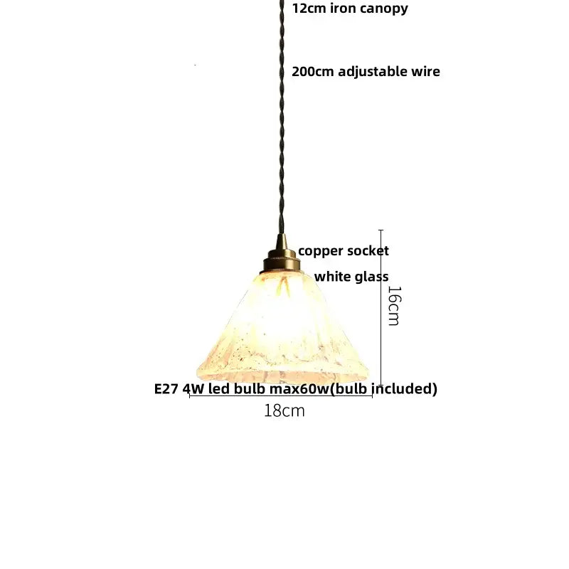 A warm glowing pendant light with textured white glass shade 18cm diameter and twisted black wire from iron canopy