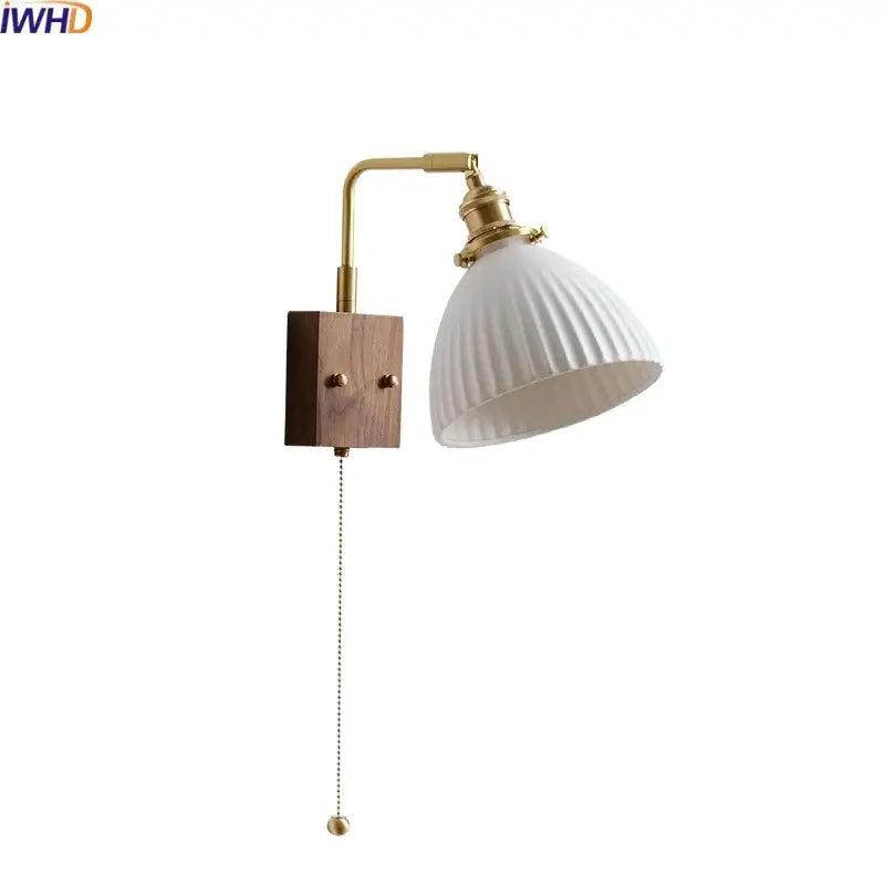 White ribbed ceramic led wall lamp with brass arm and wooden base featuring pull chain switch for bedroom mirror light