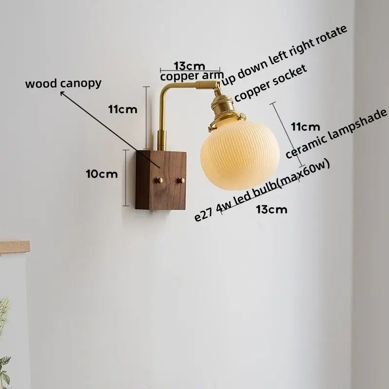 Warm-toned ribbed ceramic and copper led wall lamp mounted on dark wood canopy for bedroom mirror lighting