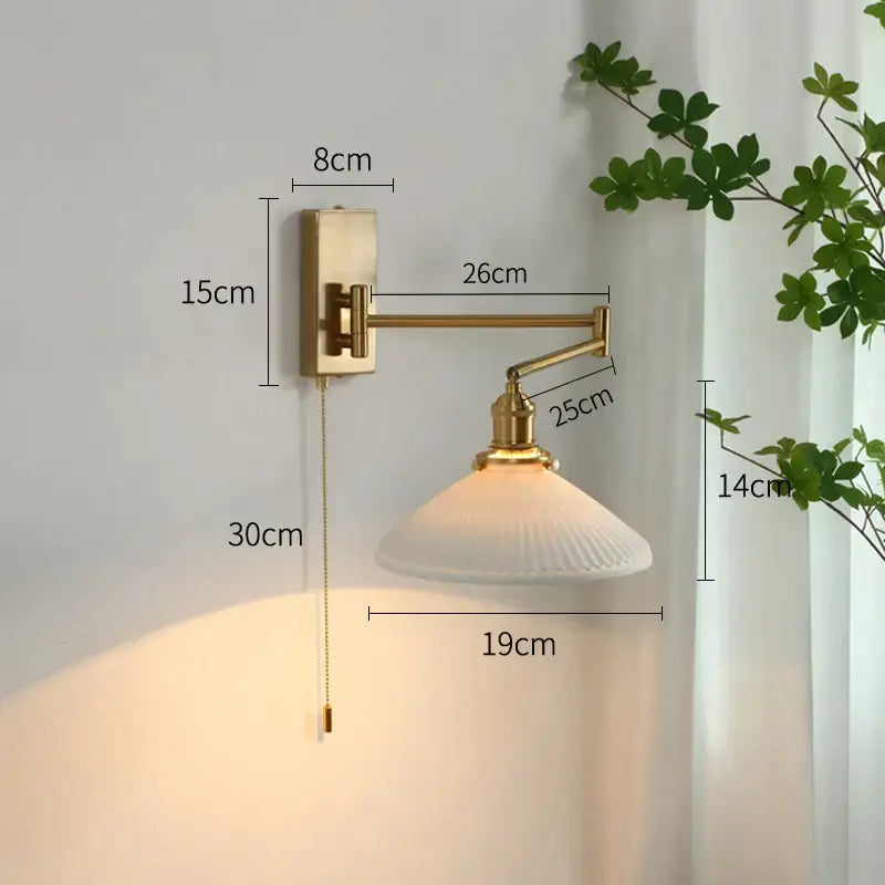 Gold-finished adjustable wall sconce with white ribbed glass shade decorbites brass swing arm for bedroom light decor