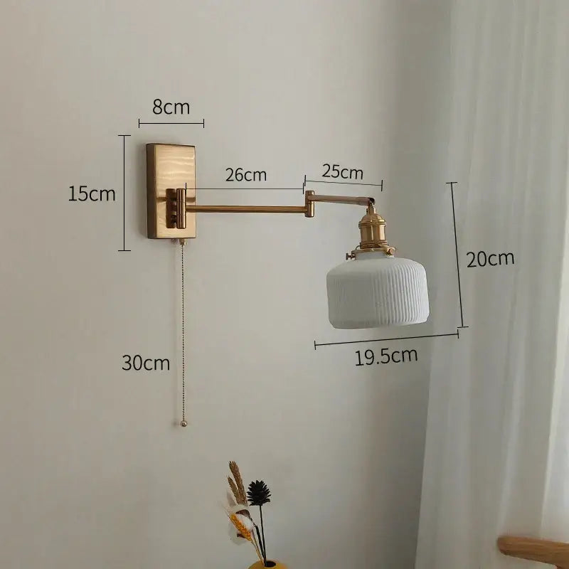 White ribbed ceramic wall sconce with brass swing arm and decorbites brass swing wall mount for bedroom light