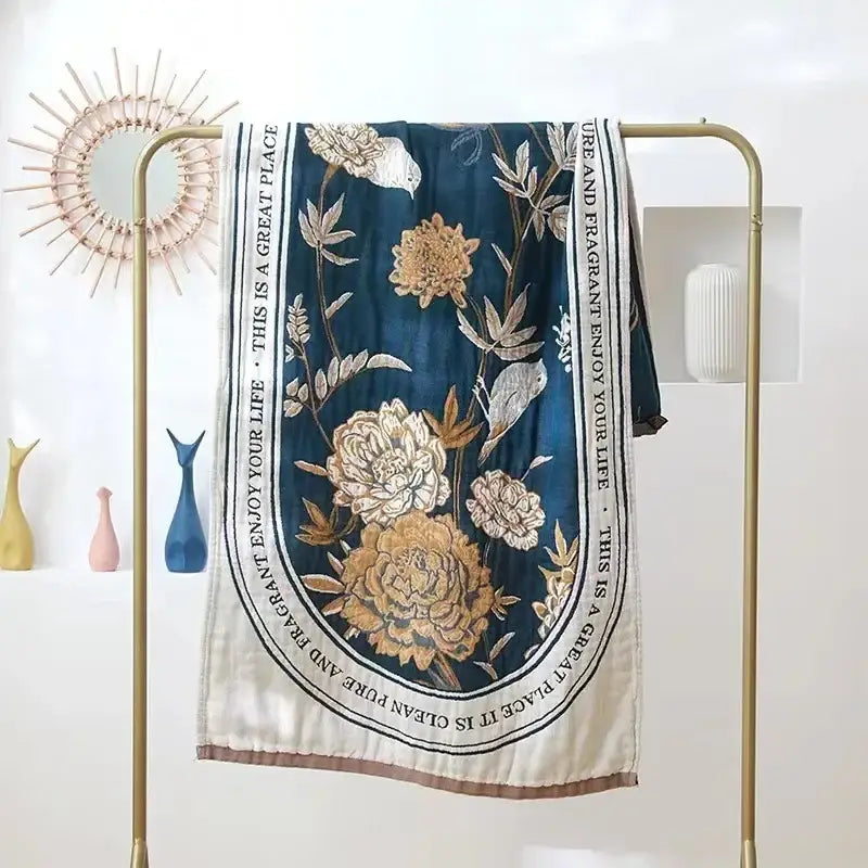 Deep blue silk scarf with gold cream floral embroidery and bird motifs bordered by white band with inspirational text