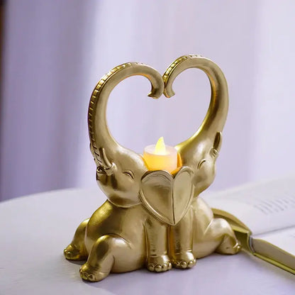 Golden elephant couple resin candlestick with heart-forming trunks and glowing led candle for romantic decorbites decor