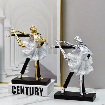Golden and silver dancing couple sculpture with white lace dresses and black pants on sleek black bases for decorbites decor