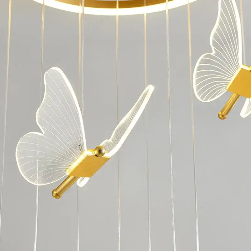 Transparent acrylic butterfly led chandelier with gold-toned accents for modern living room decorbites butterfly led light