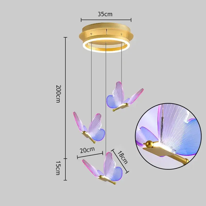 A modern gold-toned decorbites butterfly led chandelier with three translucent purple and blue butterfly elements