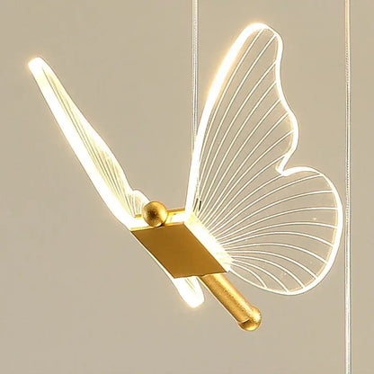 A modern decorbites butterfly led chandelier with translucent wings and gold-toned metallic body for living room decor