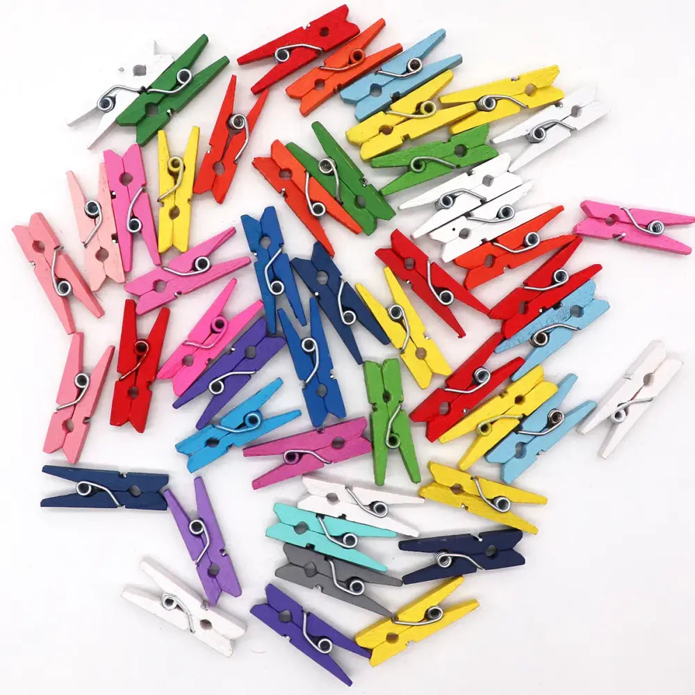 A collection of colorful romantic heart shape wood clips in vibrant hues for bedroom decor with metal springs