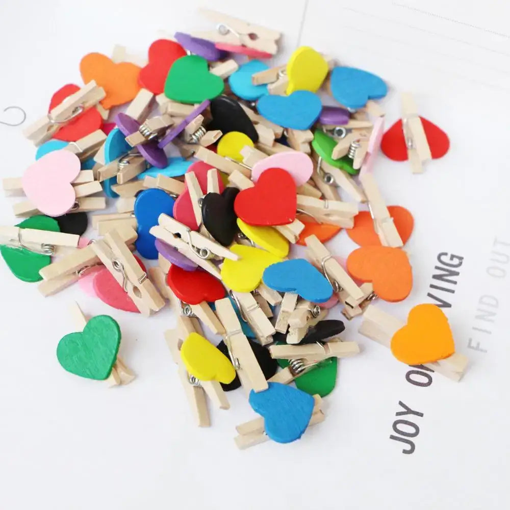 A pile of multicolor romantic heart shape wood clips with natural finish for bedroom decor