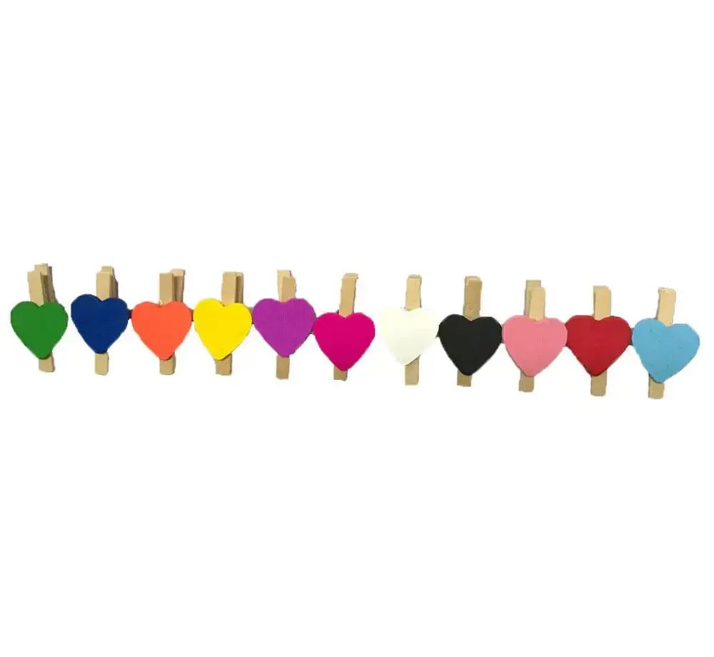 A set of ten colorful romantic heart shape wood clips made of wood with vibrant painted surfaces for bedroom decor