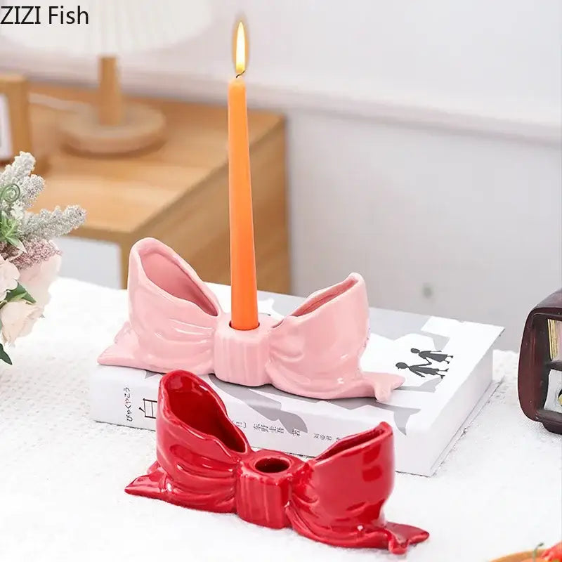 Romantic pink decorbites bowknot ceramic candle holder with central hole holding orange taper candle for dining room decor