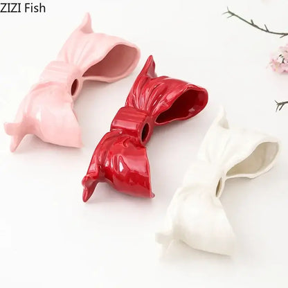 Romantic pink red and white bowknot ceramic candle holder with glossy finish for dining room decor by decorbites bowknot ceramic