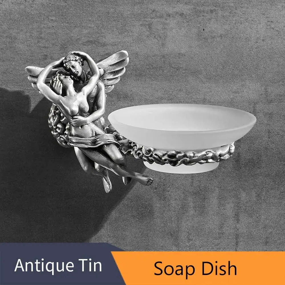 Silver angel-themed bathroom hardware set with ornate sculpted wings and frosted white ceramic soap dish bowl