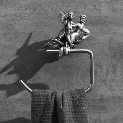 Silver-toned metal towel ring with ornate winged angel sculpture, part of a romantic silver bathroom hardware set