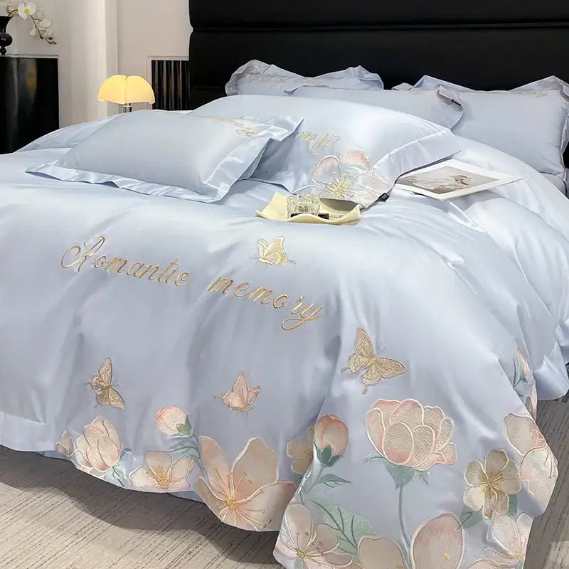 Light blue satin bedding set with embroidered pink and peach flowers butterfly and romantic memory text in gold thread