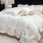 Romantic white satin bedding set with delicate pink and gold embroidered flowers butterfly design and elegant script