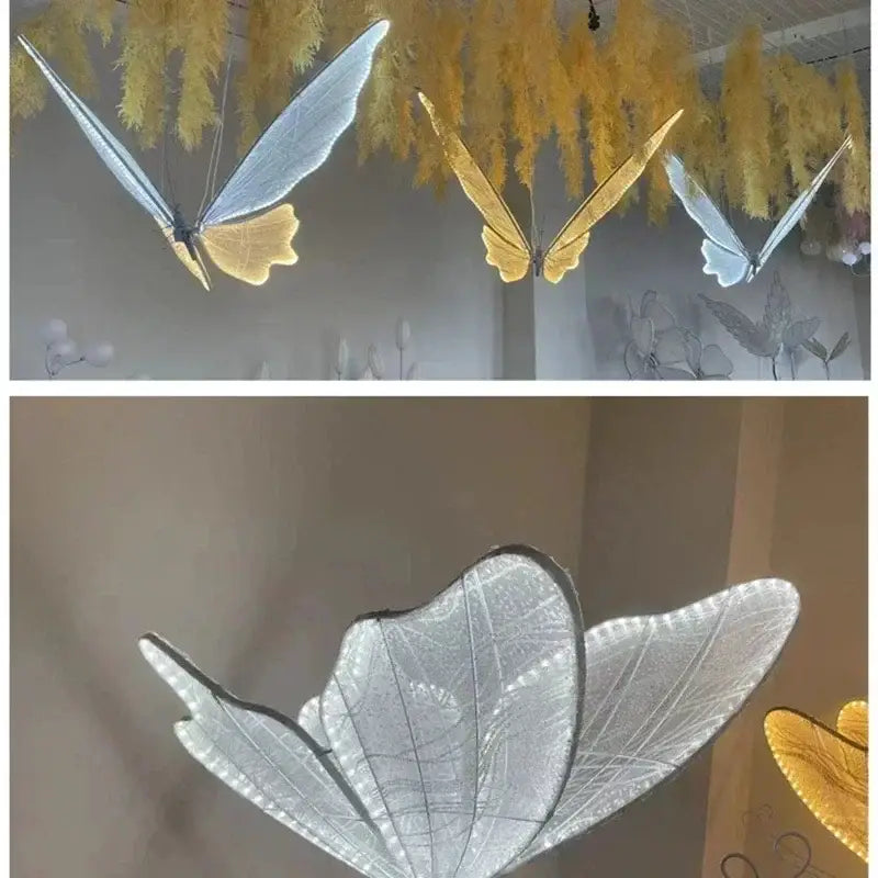 Elegant romantic white and gold butterfly wedding decoration floor lamp with illuminated translucent wings and glowing LED lights