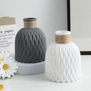Two ceramic rope plastic vases with wavy textured surfaces in matte gray and white for living room decoration