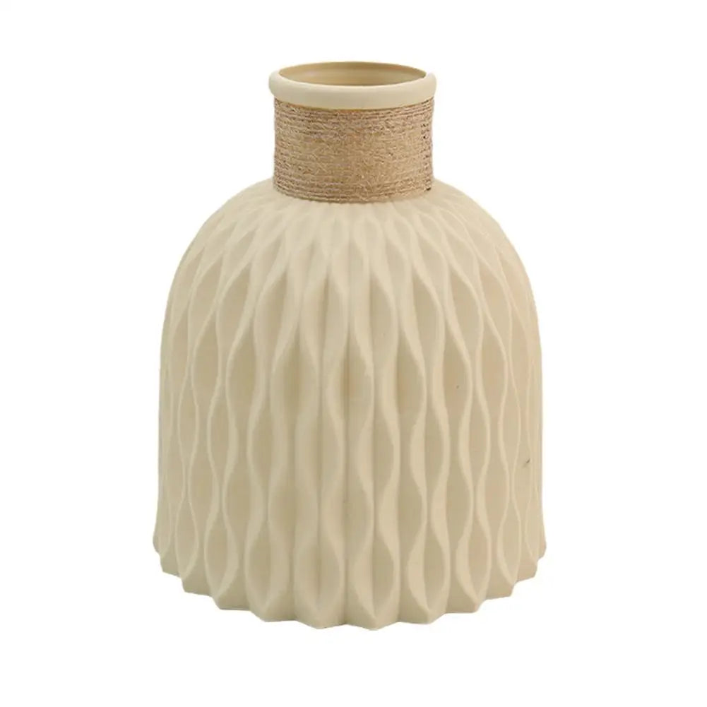Cream-colored ceramic rope vase with textured waves and natural twine band for living room flower decoration