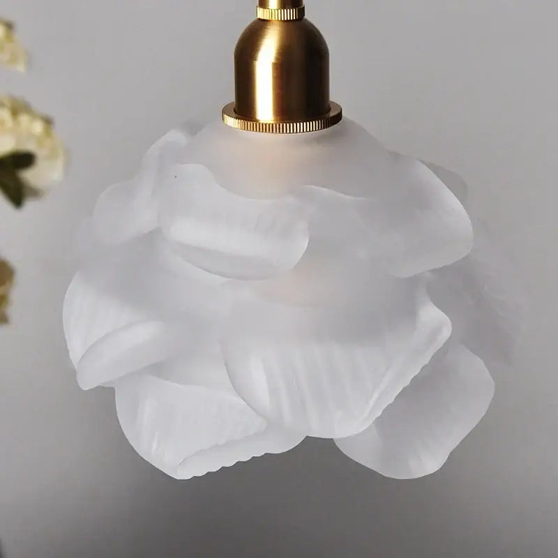 White frosted glass pendant light with brass rose design and glass knob switch for bedroom use