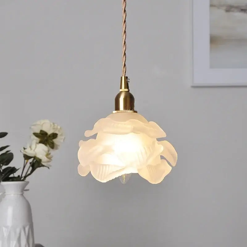 Rose and white glass knob switch pendant light featuring a delicate translucent flower-shaped glass knob for bedroom use