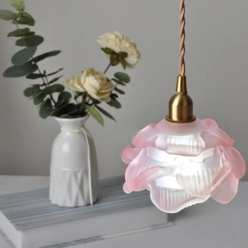 Rose and white glass knob switch pendant light with pink floral glass and brass-finished top for bedroom use