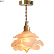Rose frosted white glass pendant lamp featuring a warm-toned translucent rose design with brass fixture and twisted cord