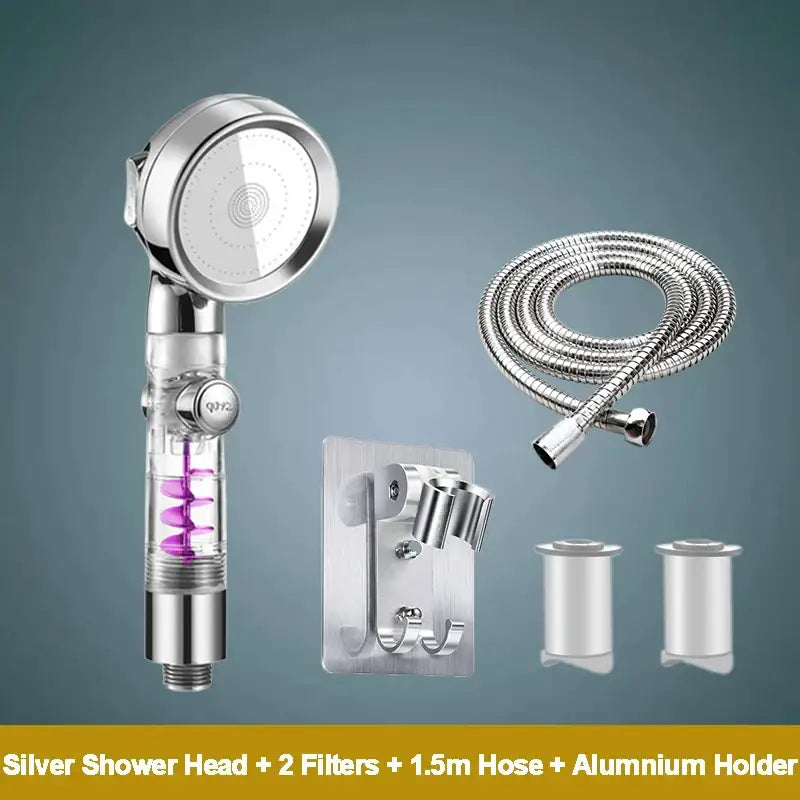 Silver handheld shower head with transparent body showing purple spiral filters and chrome accents for high pressure shower experience