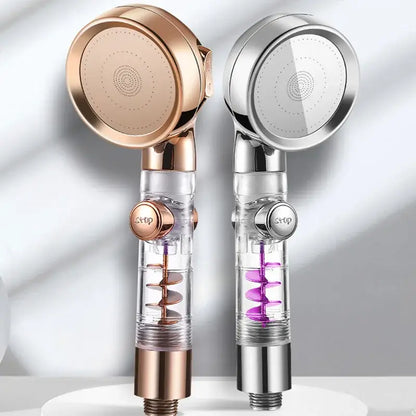 Two modern handheld showerheads in rose gold and chrome with transparent bodies for a high pressure shower experience