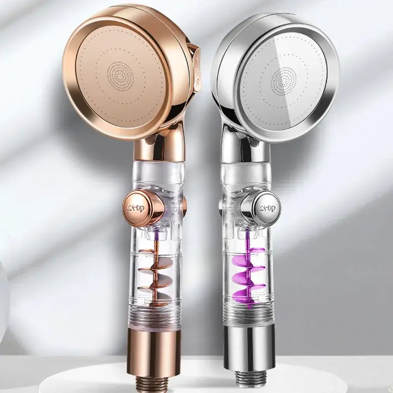 Two modern high pressure shower heads in rose gold and chrome with transparent bodies and internal spiral filters
