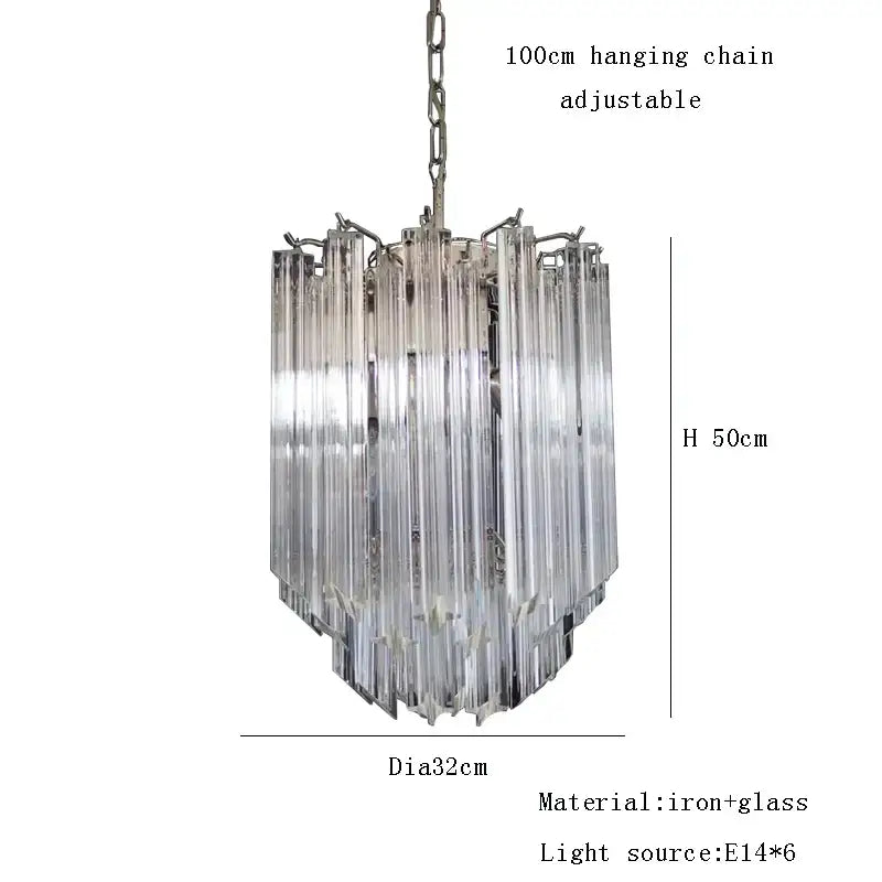 A rose gold pink glass chandelier with clear glass tubes cascading in a kitchen pendant light design