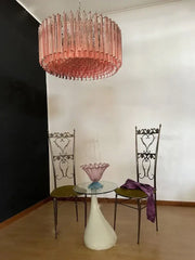 Rose gold pink glass chandelier with cascading translucent glass tubes ideal for kitchen or living room lighting