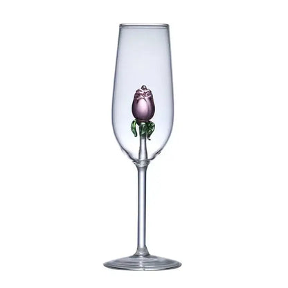 A clear glass rose stemware wine glass features a hand-blown purple decorbites 3d rose with green leaves in the stem