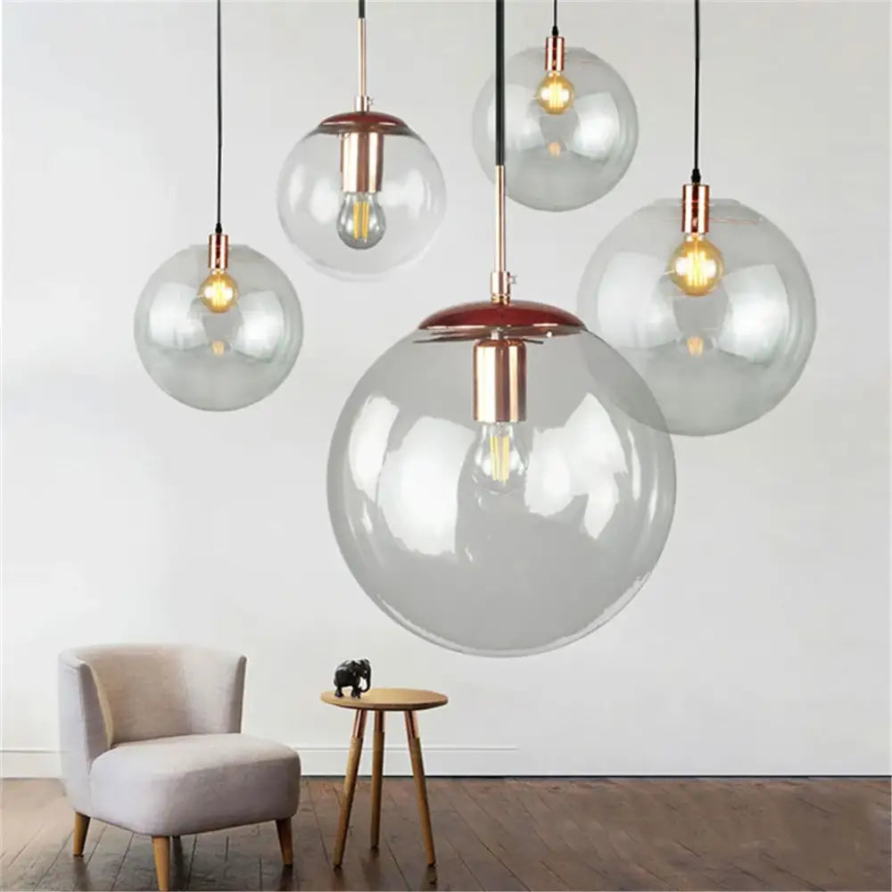 Round clear glass lamp shade replacement with copper accents and warm filament bulbs for living room decorbites clear glass