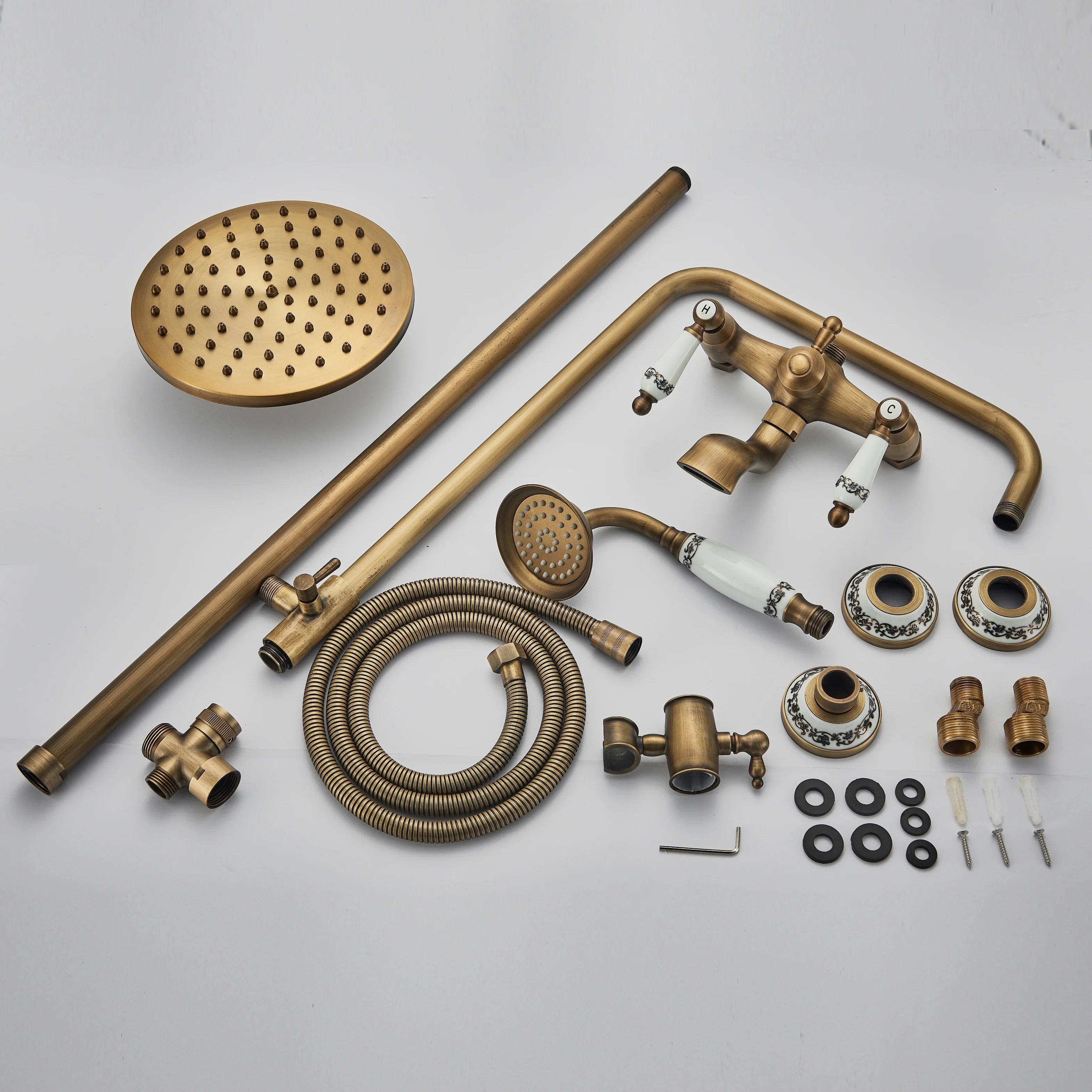 Antique brass shower faucet set with white ceramic handles and mosaic tile accents for bathroom shower use