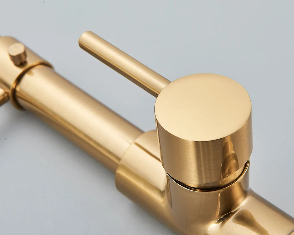 Gold-toned rozin brushed nickel deck mounted kitchen faucet with single hole, cylindrical spout, and 360 degree rotation