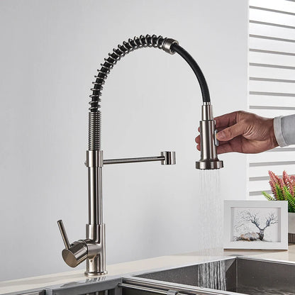 Modern Rozin brushed nickel deck mounted kitchen faucet with single hole flexible coiled hose and pull-out spray head